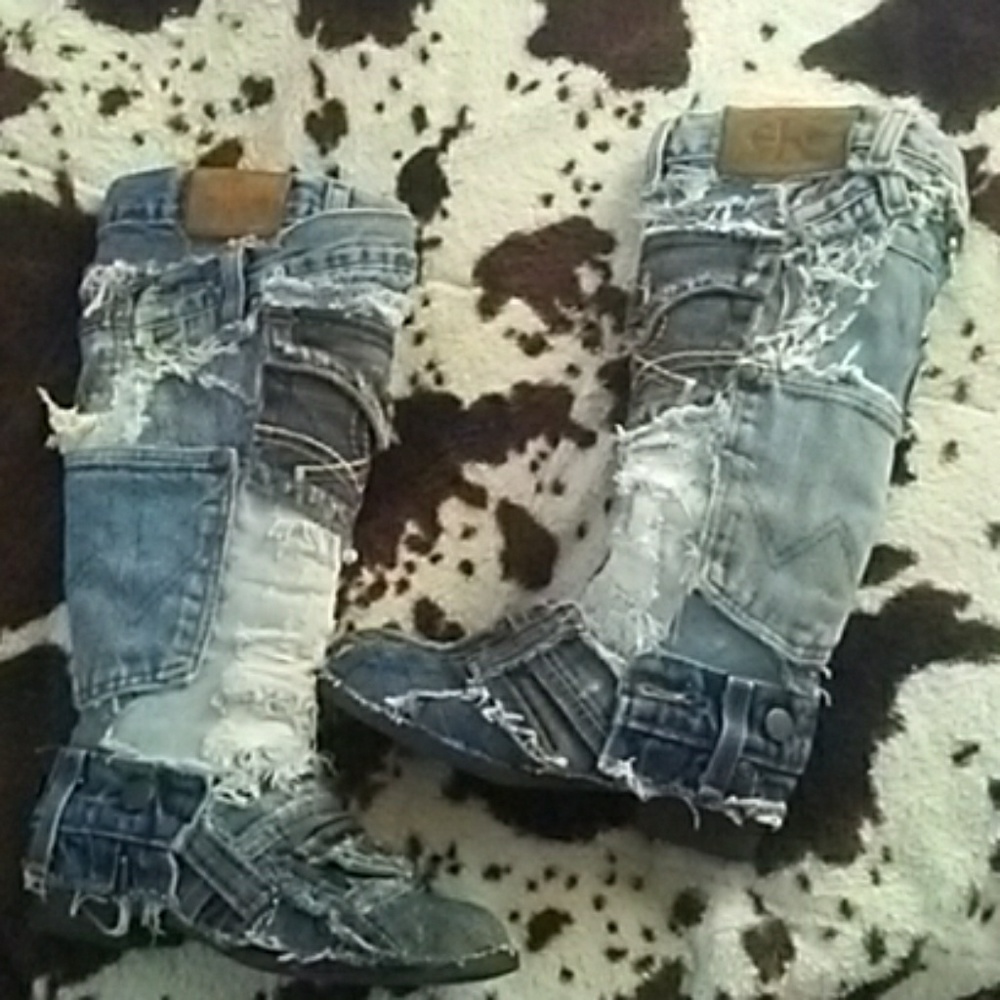 Distressed denim knee high boots